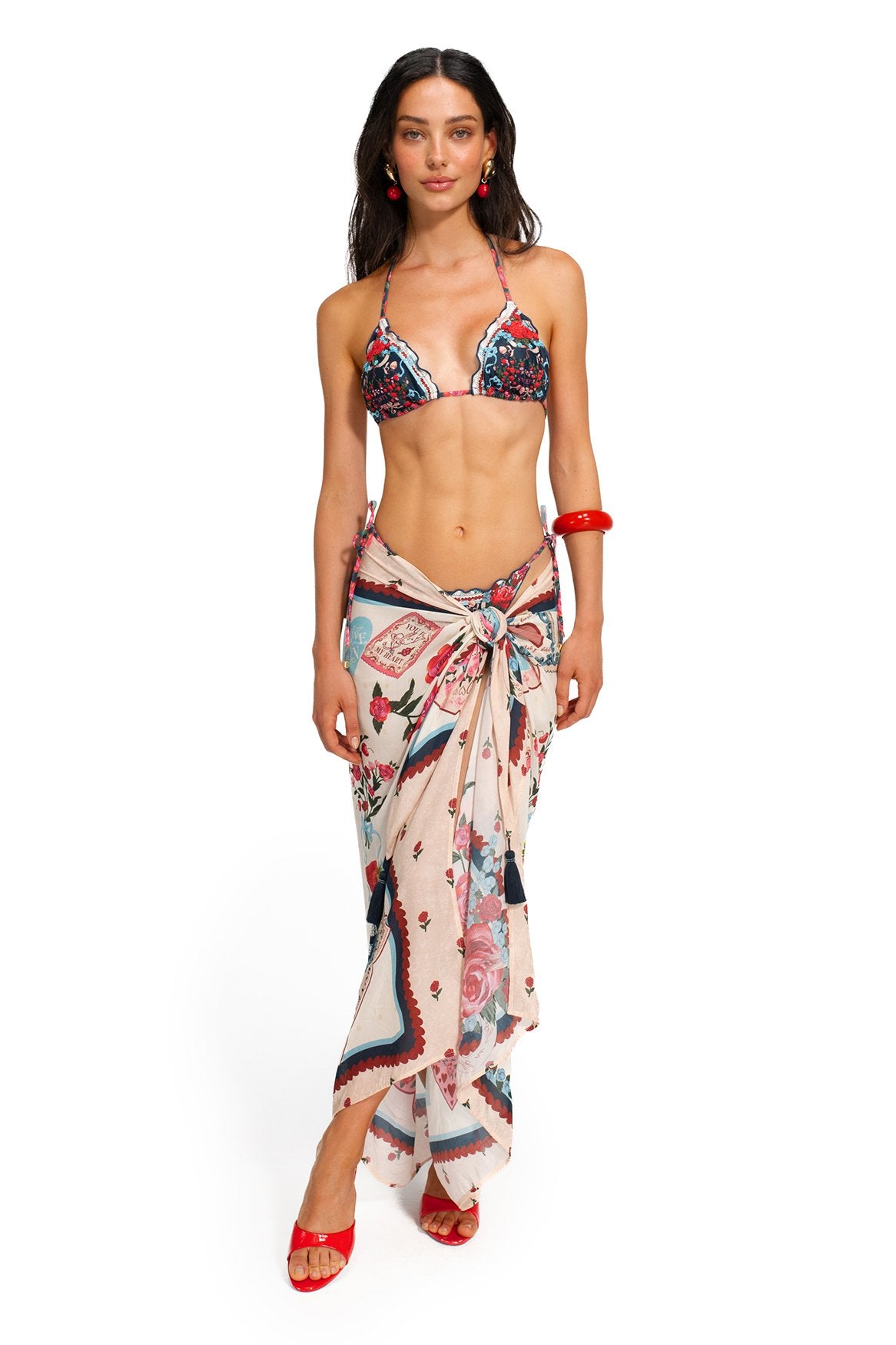 Marine Pareo cover-up in cream with pattern detail print, blue scalloped border, and handmade tassel details at edges